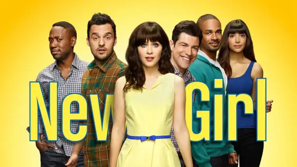 Il cast di New Girl, con Jess al centro in giallo, circondata dai suoi amici.