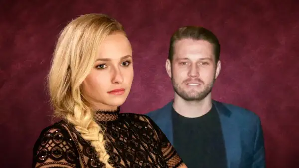 Hayden Panettiere oggi, con un uomo sullo sfondo. Lei indossa un abito di pizzo nero.